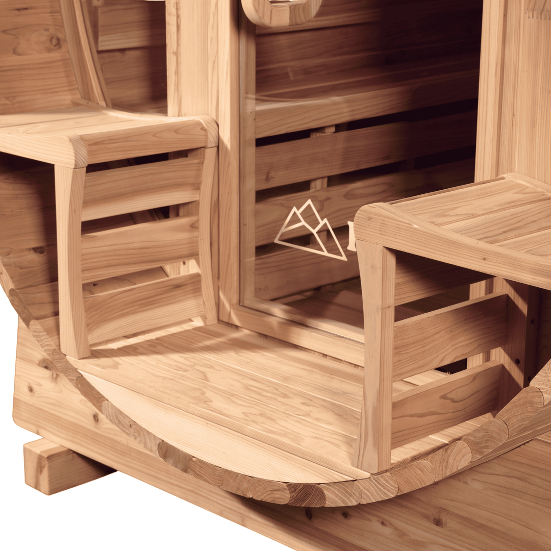 Wooden barrel sauna with benches and a door by peak sauna ice mornington