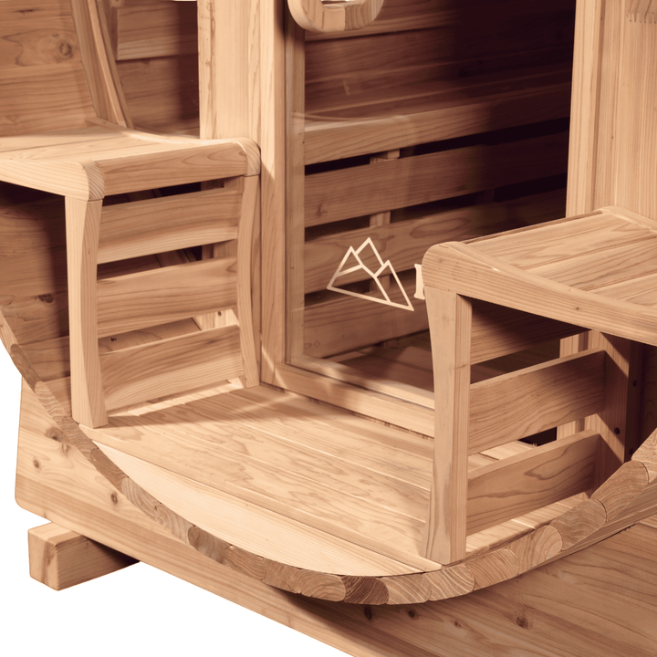 Wooden barrel sauna with benches and a door by peak sauna ice mornington