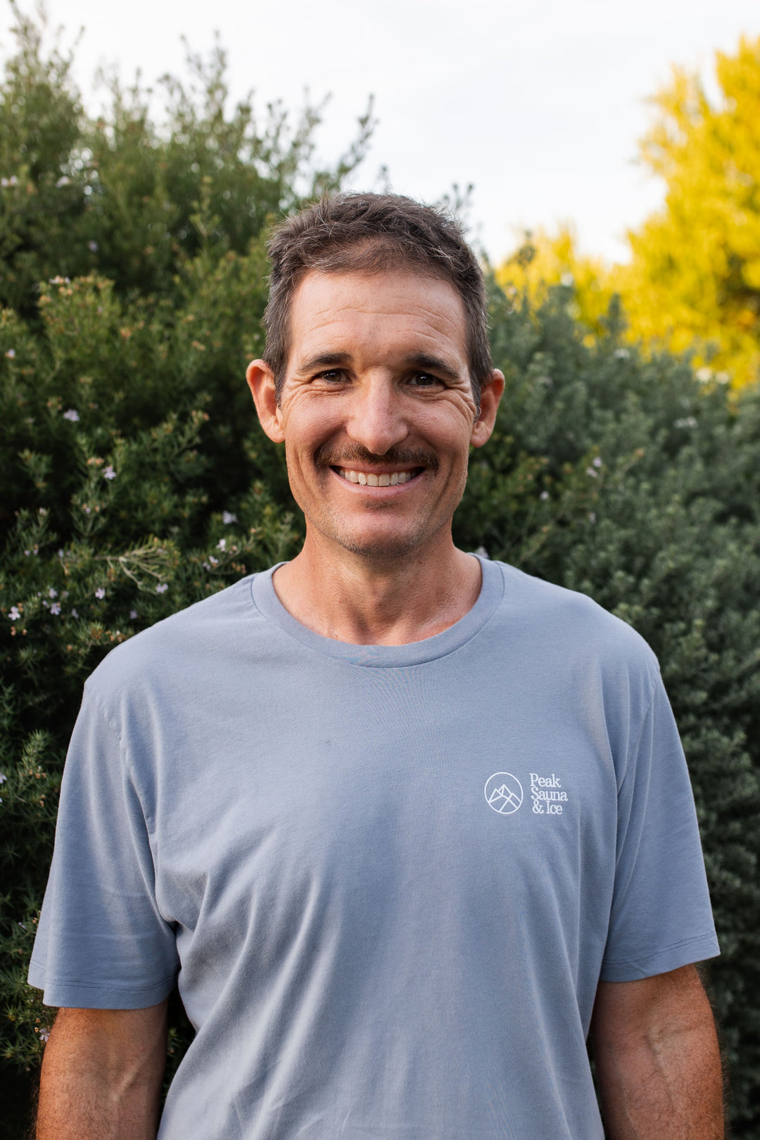 portrait shot of man wearing peak sauna and ice shirt in melbourne